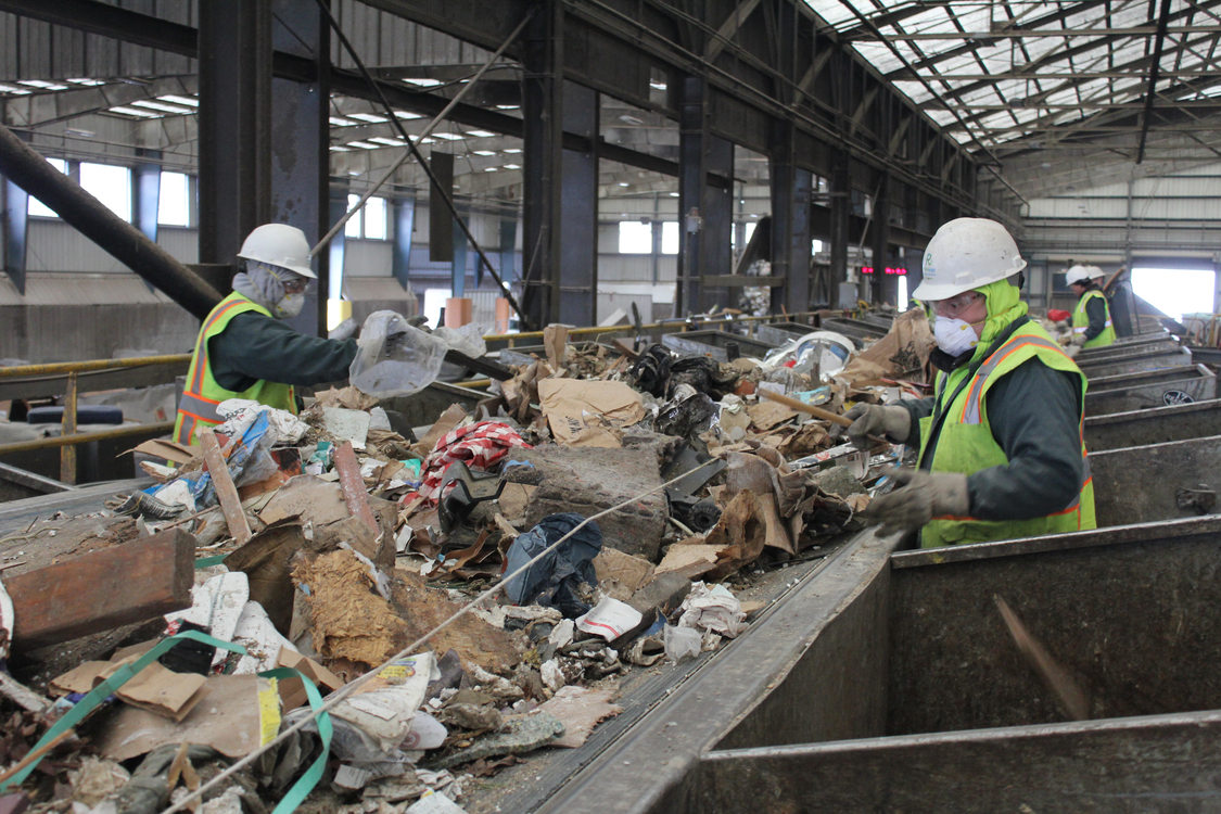 Recology workers sort through dry waste, pulling all recyclables from the waste stream. All dry waste at the facility goes through this process. 