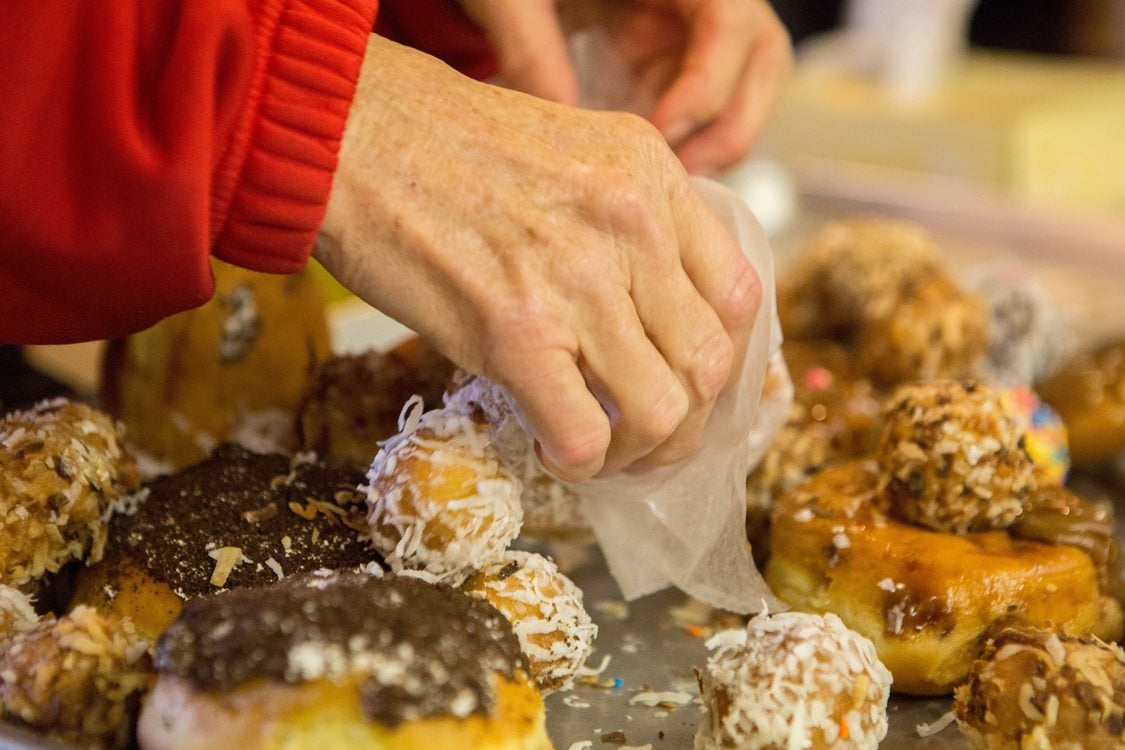 A visitor at the Clackamas Service Center chooses a donut