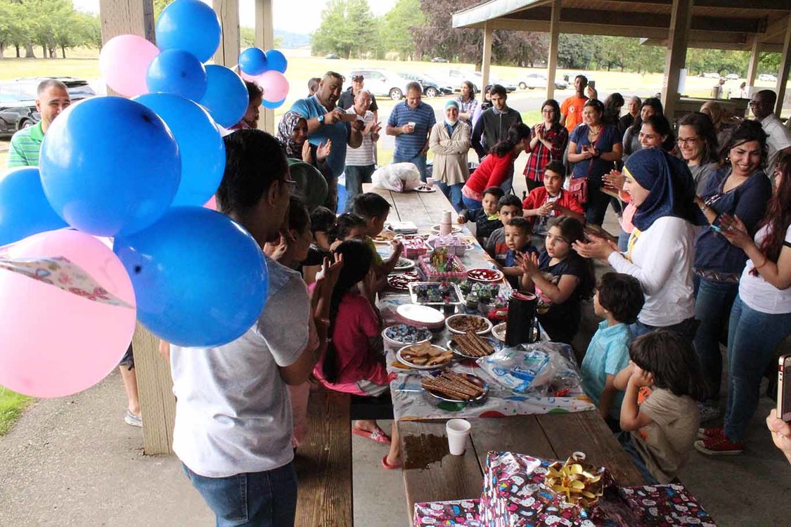 Iraqi refugees celebrate a birthday at Blue Lake Regional Park