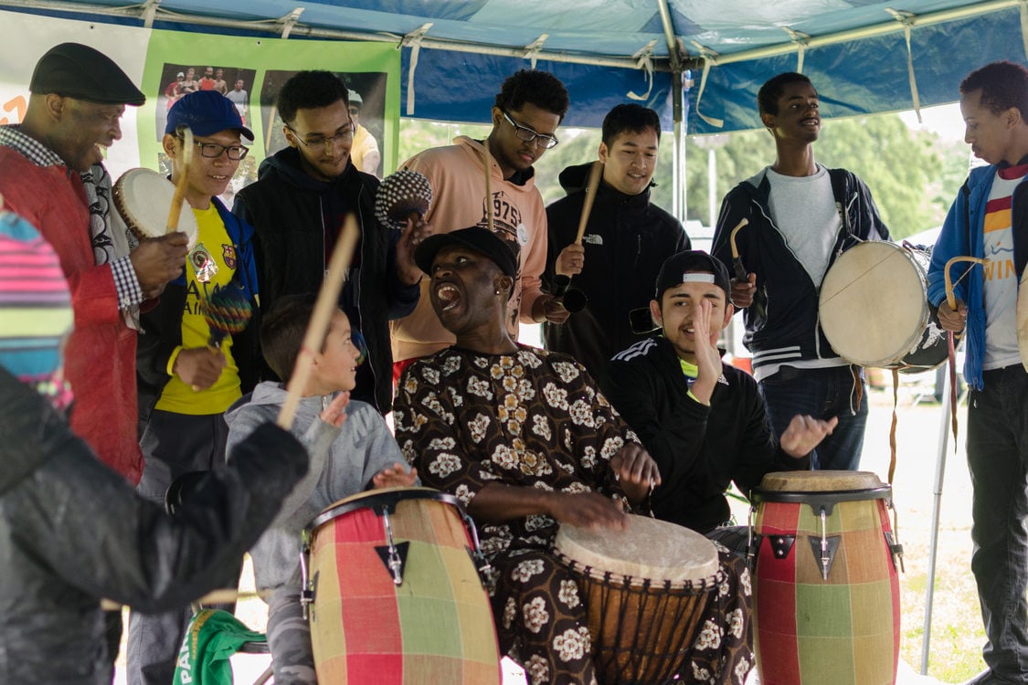 photo of participants playing drums at Sunday Parkways