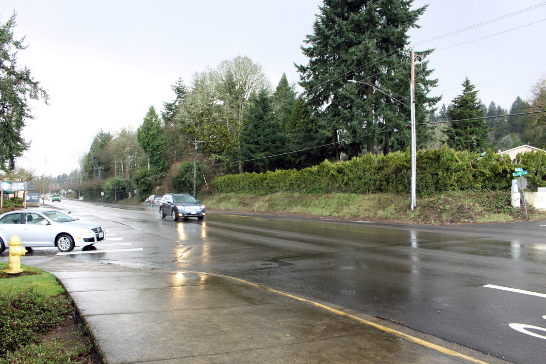 traffic driving along Highway 43 in the rain