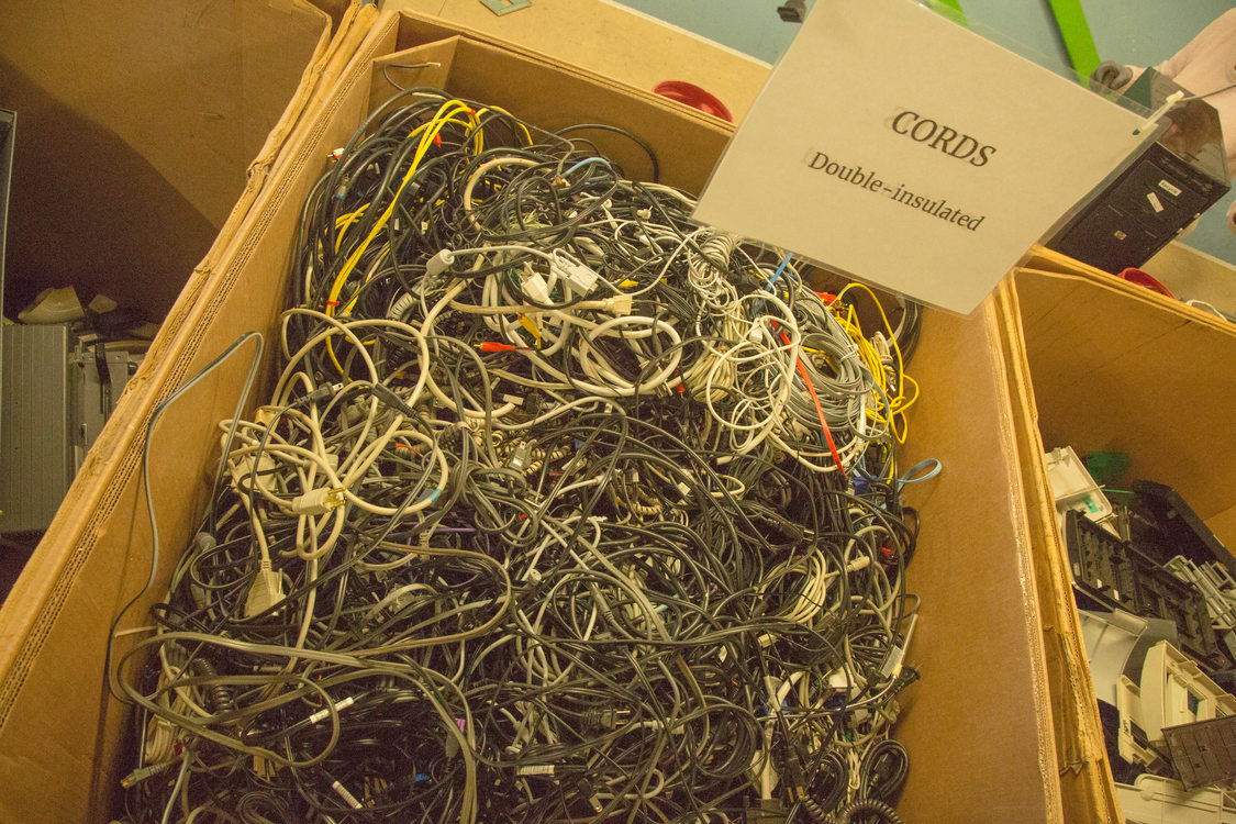 box filled with electronics power cords to be recycled
