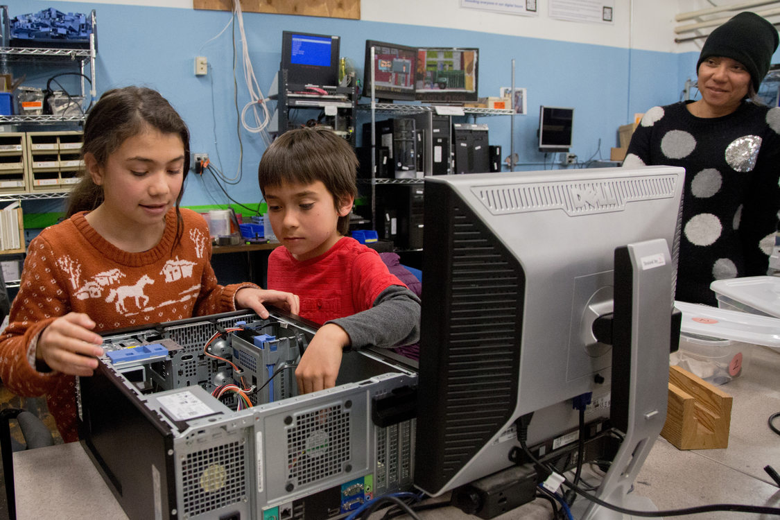 two children learning to build a computer