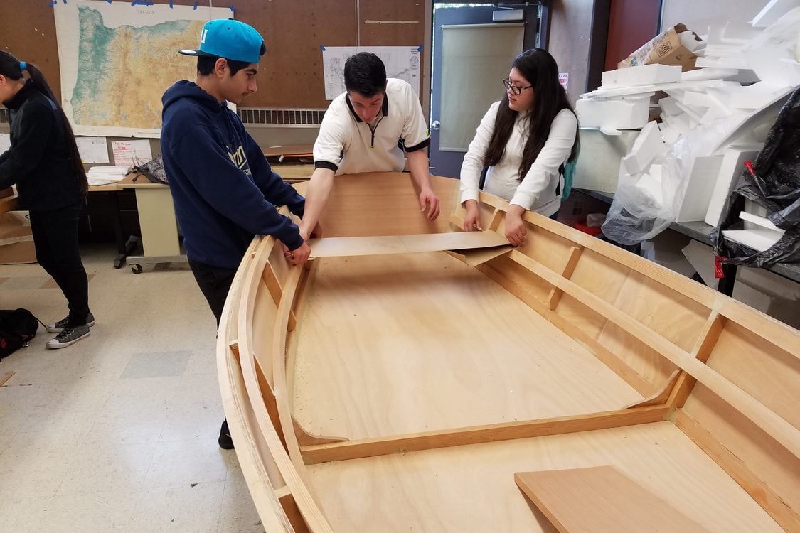 photo of George Middle School students building boat