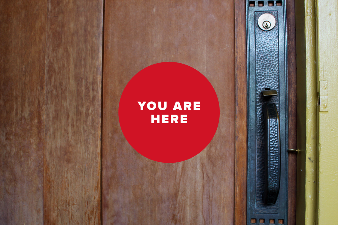 You are here logo with door knob 