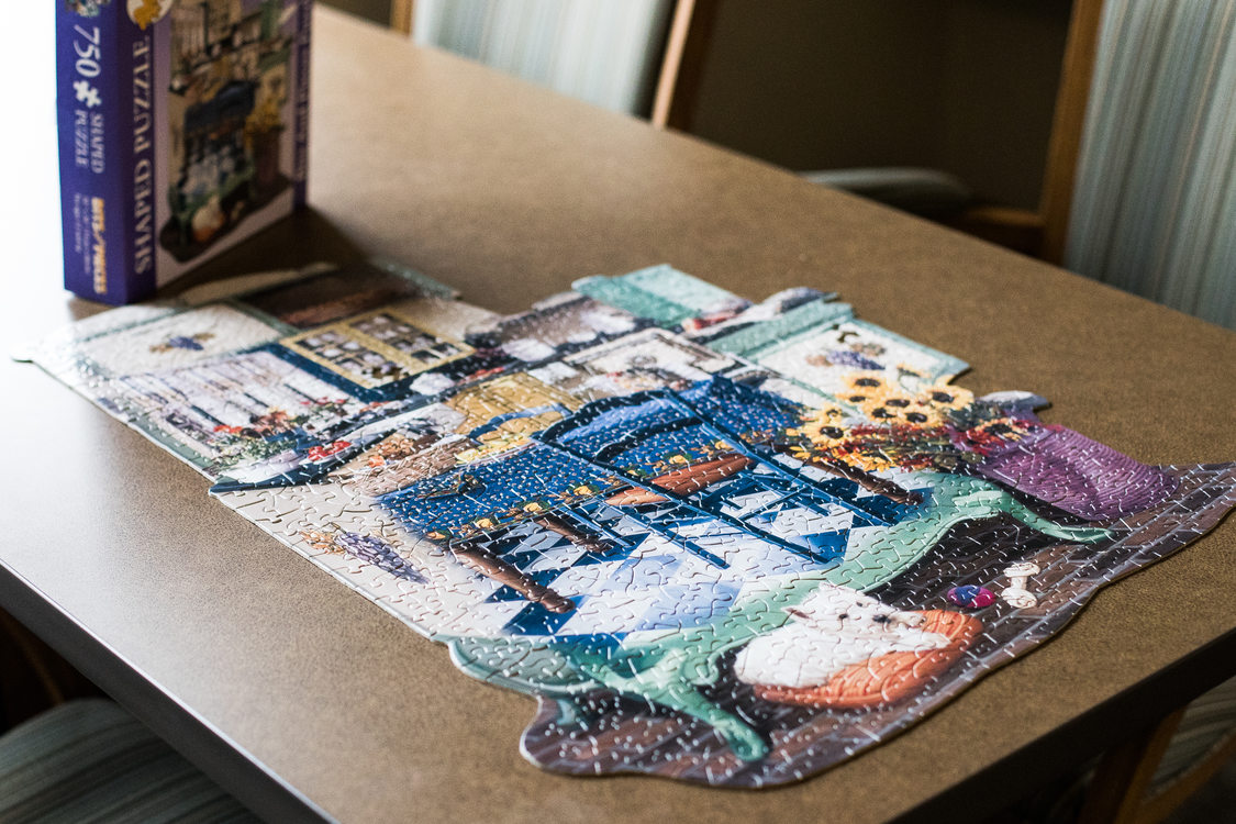 A jigsaw puzzle waits on a table in a community room at Alma Gardens