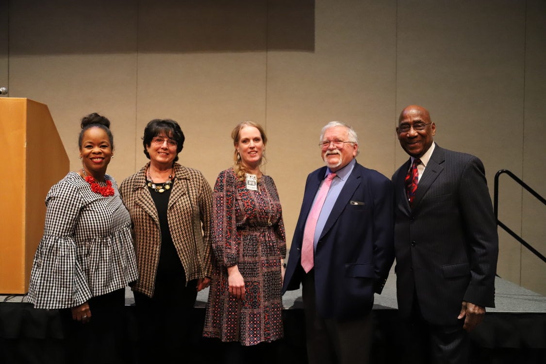 Organizers and council members pose