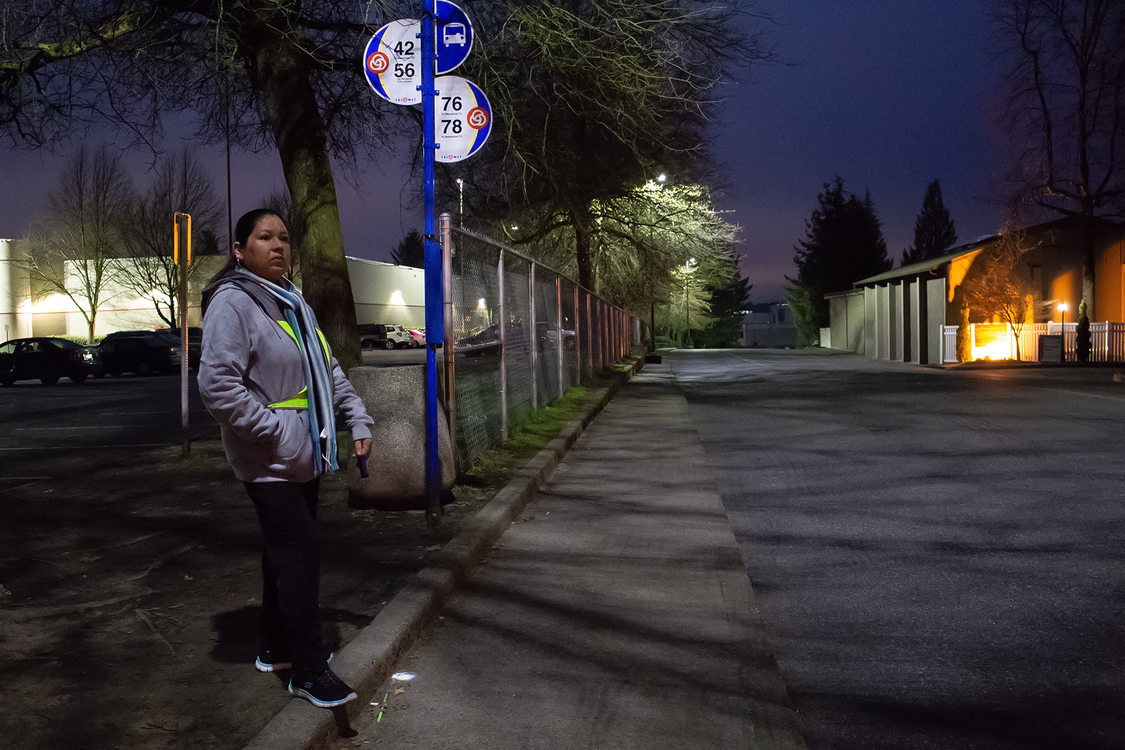 A portrait of Manuela Martinez Espinoza waiting for her bus on an early Saturday morning.