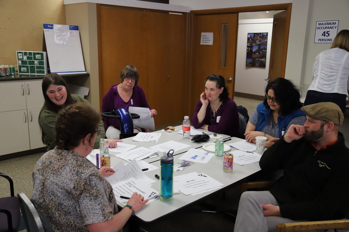 Portland disability community members engage in small group discussion