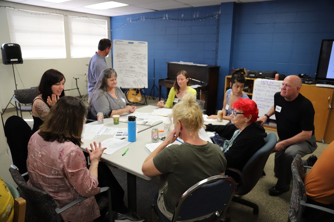 Portland disability community members engage in small group discussion