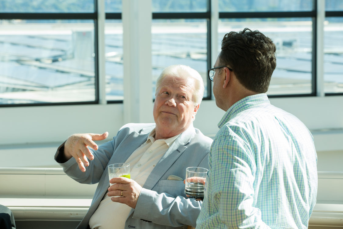 Photo of people chatting at a reception