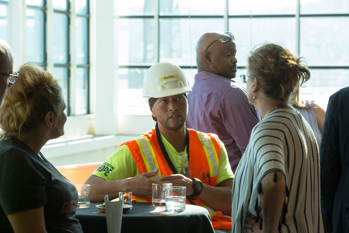 Photo of people chatting at a reception