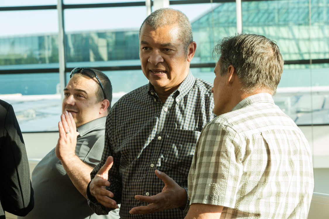 Photo of people chatting at a reception