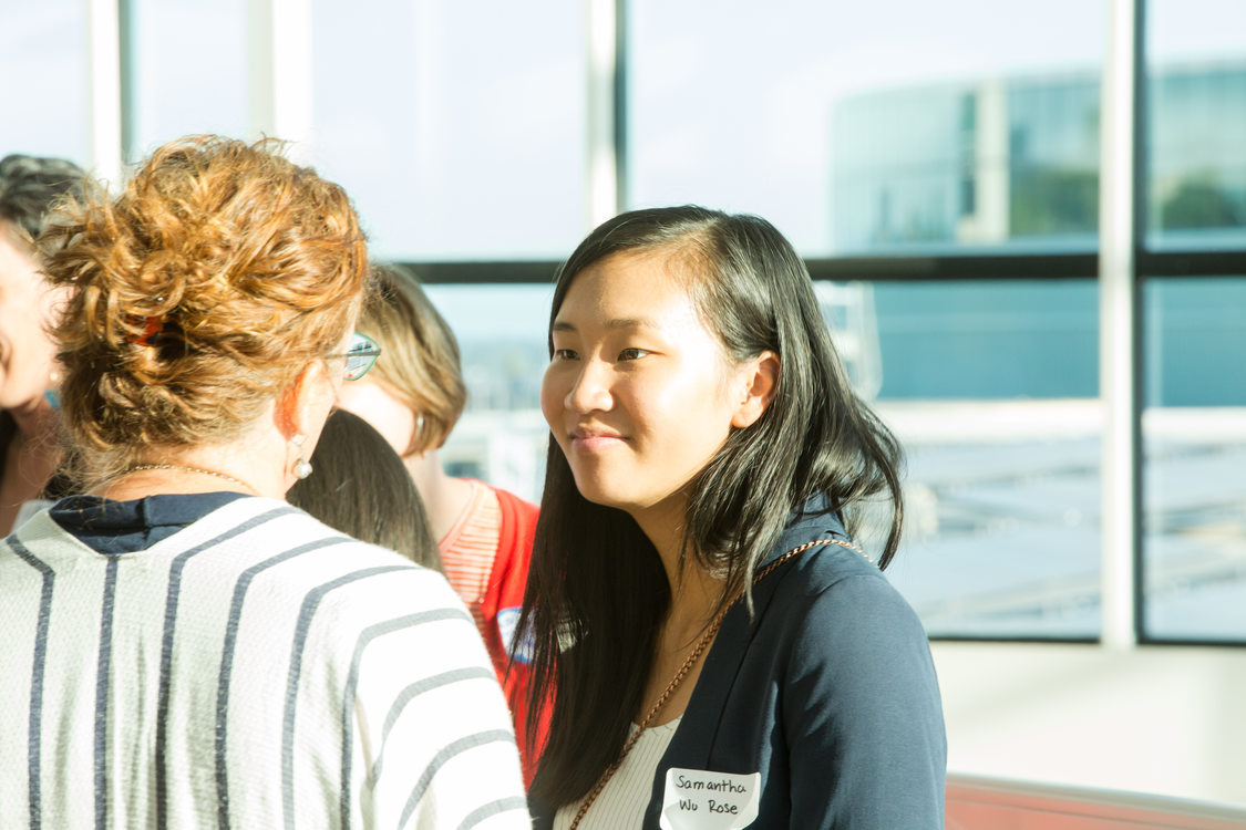 Photo of people chatting at a reception