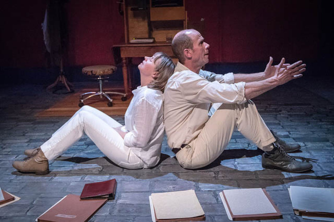 a male and female actor share the stage during dramatic performance