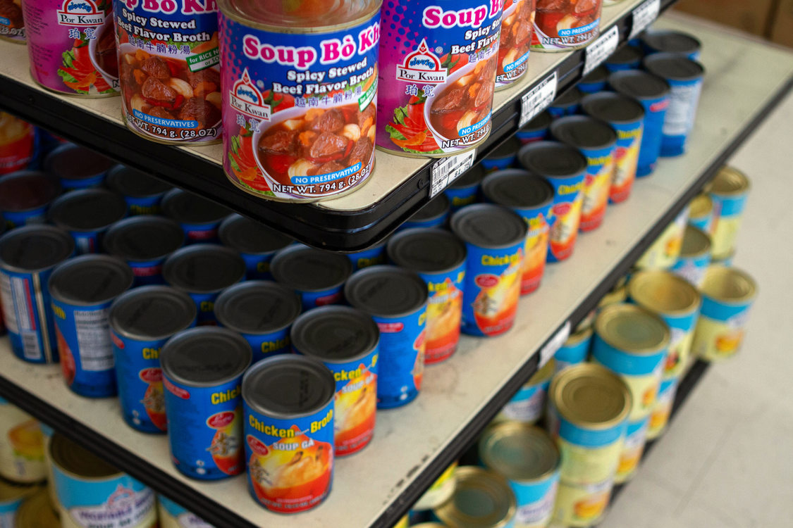 metal soup cans sit on a store shelf