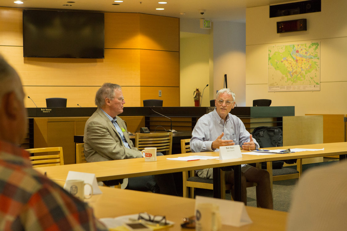 Photo of people sitting around tables during a discussion