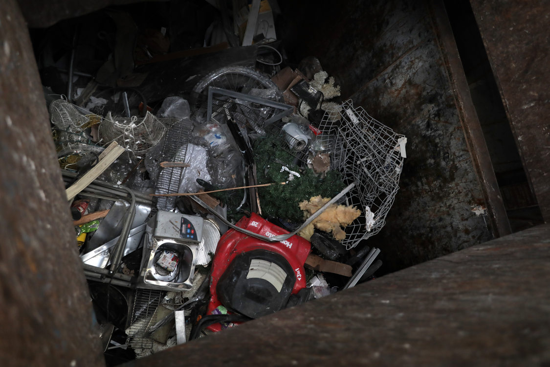 A large bin full of metal items