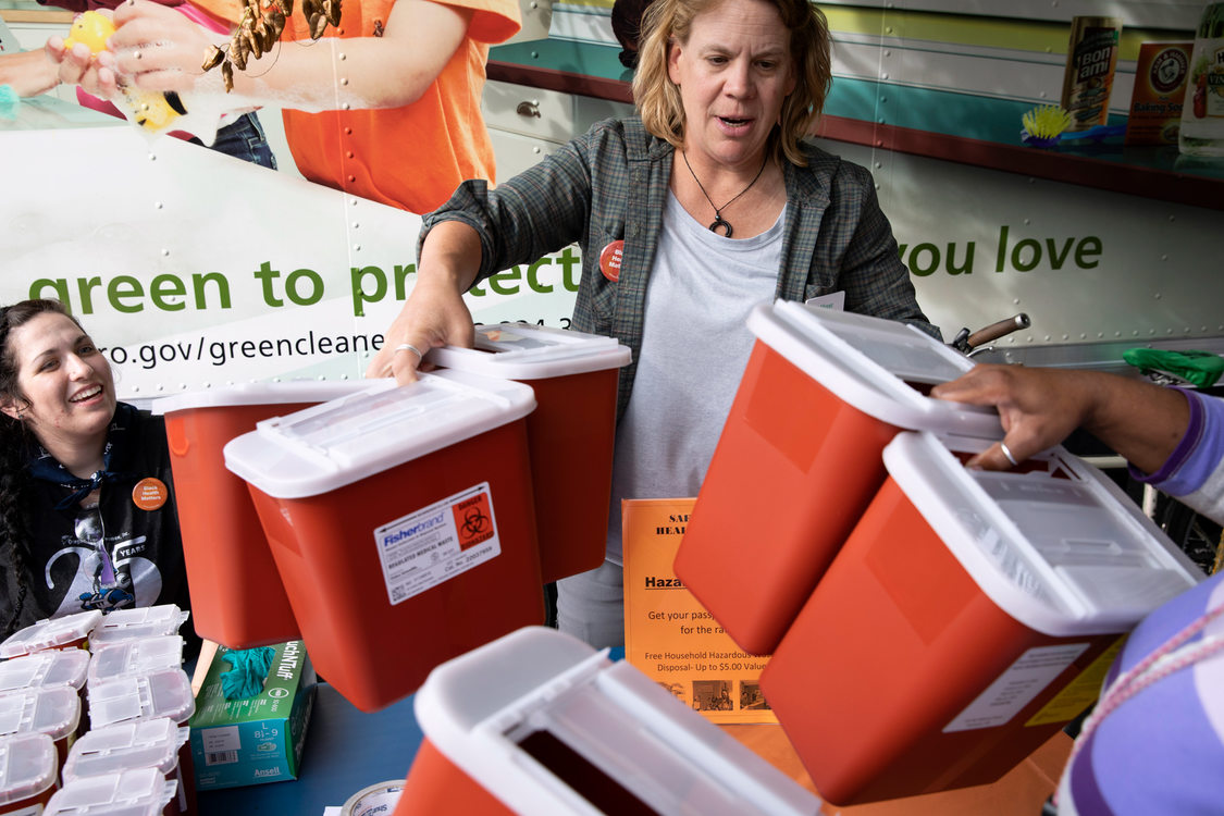 metro employees hand out free sharps containers