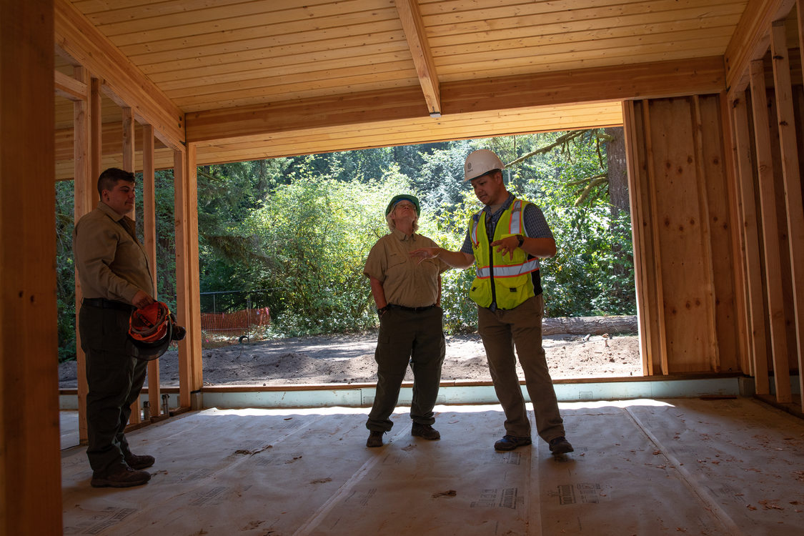 Construction manager inside partially finished welcome center.