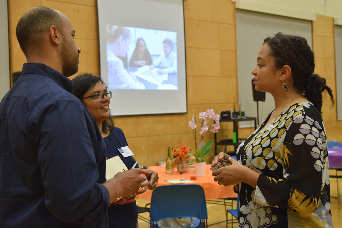 Man and two women talking after meeting