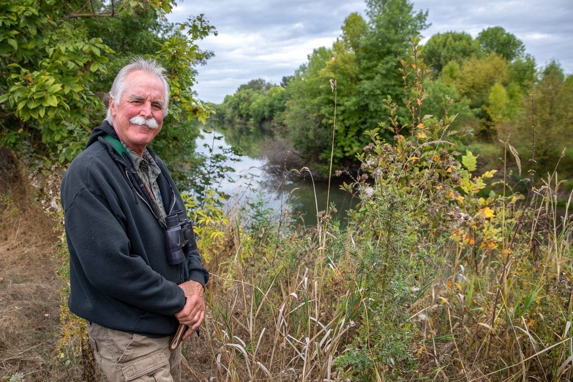 Troy Clark stands at the edge of St. Johns Prairie