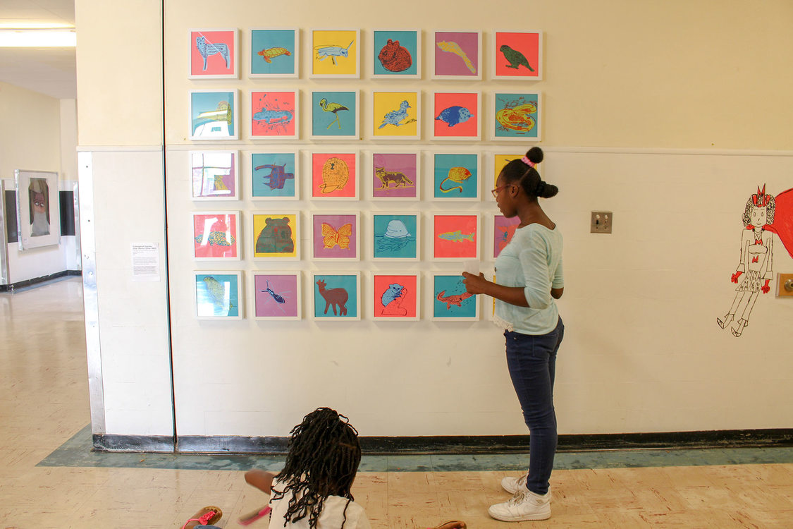 Two little girls in a school hallway