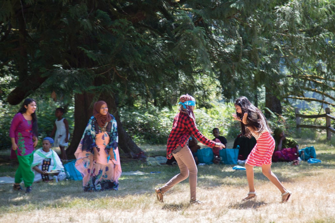 Teenagers working with the Immigrant and Refugee Community Organization play at Oxbow Regional Park.