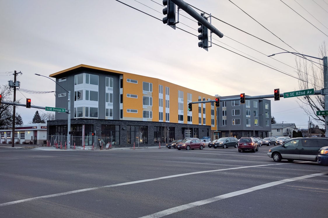 the view of a new apartment building from the corner of SE 82nd Avenue and Division Street
