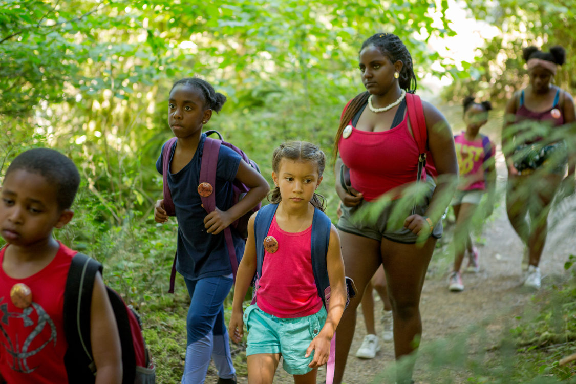 Children taking part in Camp ELSO's 2018 summer camp walk through the ancient forest at Oxbow Regional Park.Camp ELSO was awarded $100,000 for its Young Black Environmentalists Internship Program.