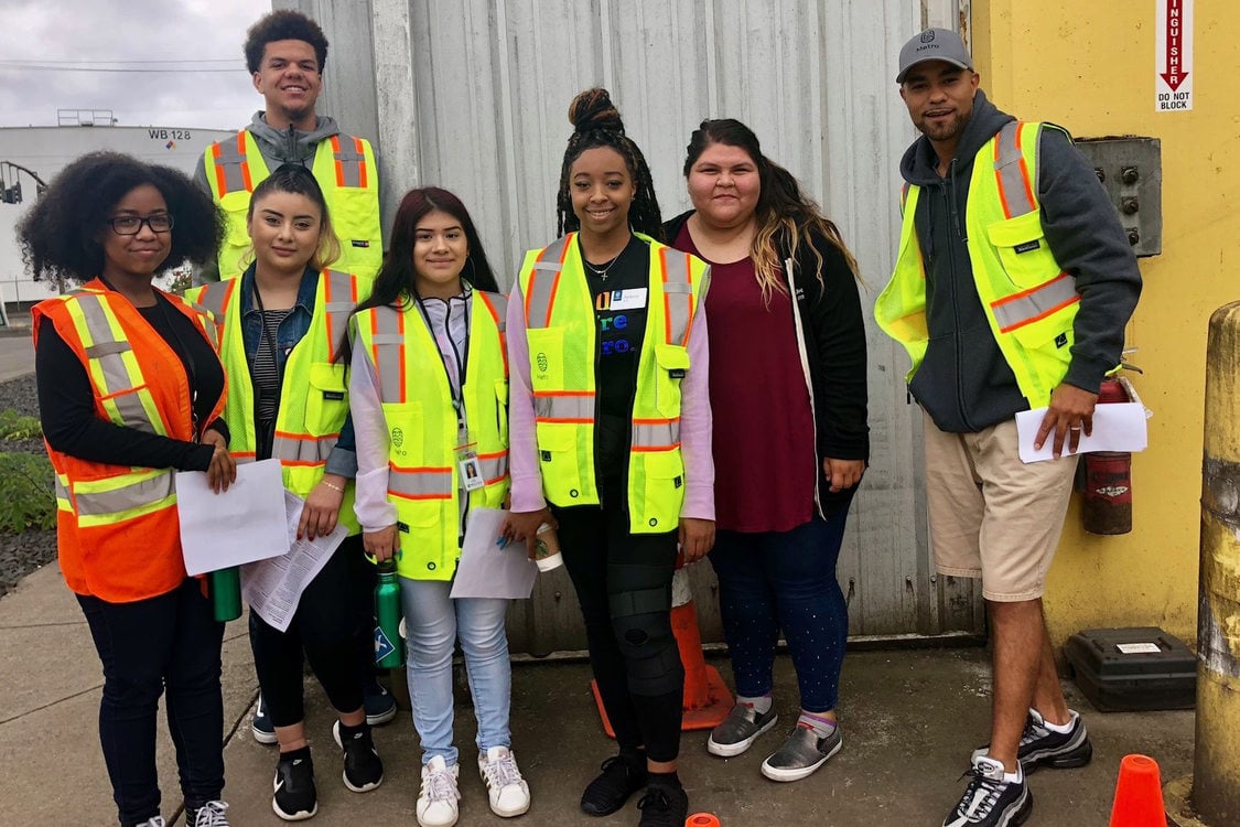garbage and recycling interns touring a transfer station