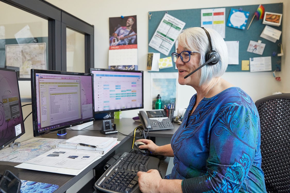 recycling expert on the phone at her desk