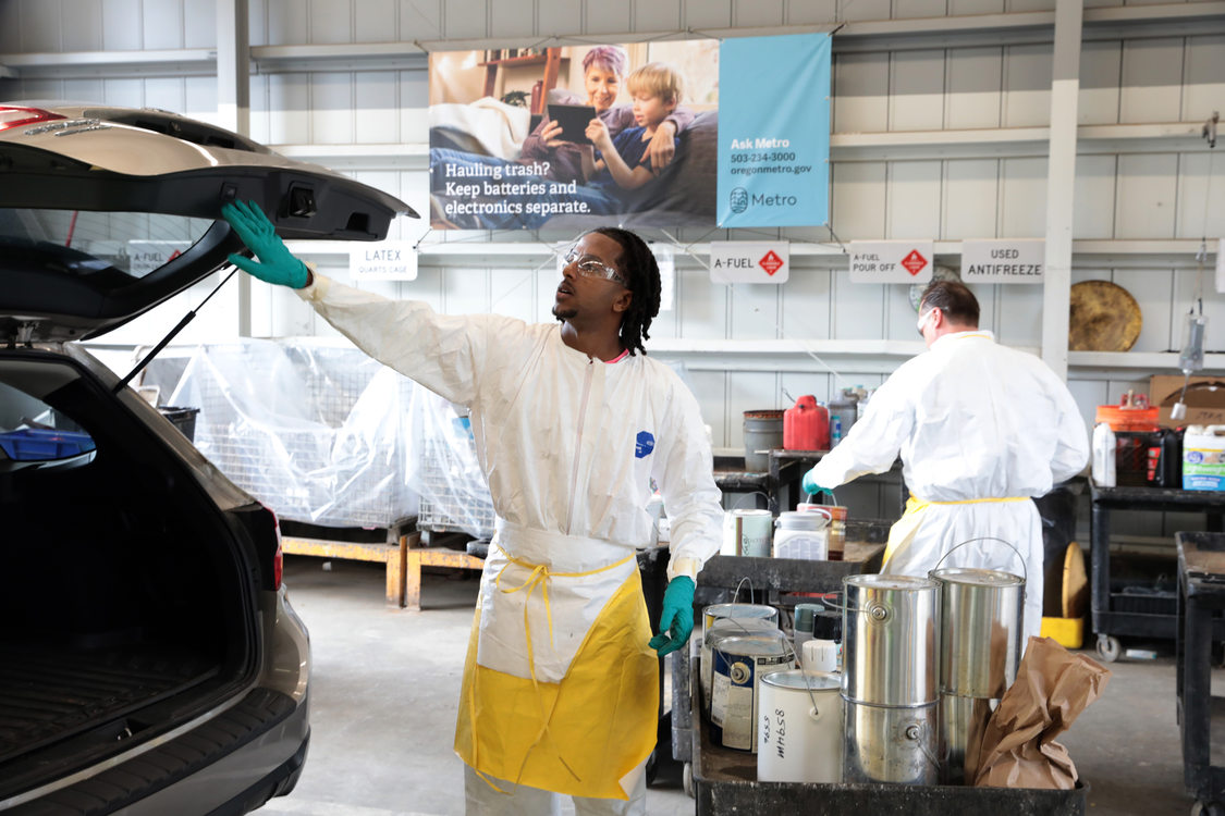 Staff at Metro South assisting customers with household hazardous waste disposal