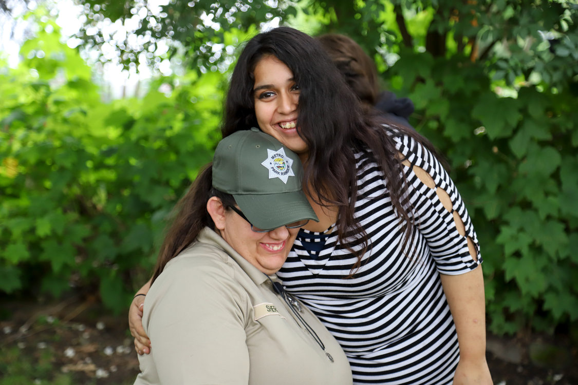 side hug between ranger and woman