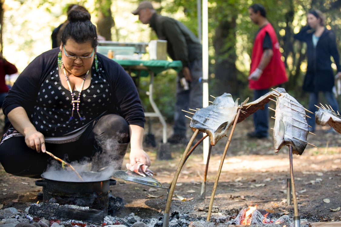 Savahna Jackson prepares salmon soup for volunteers.