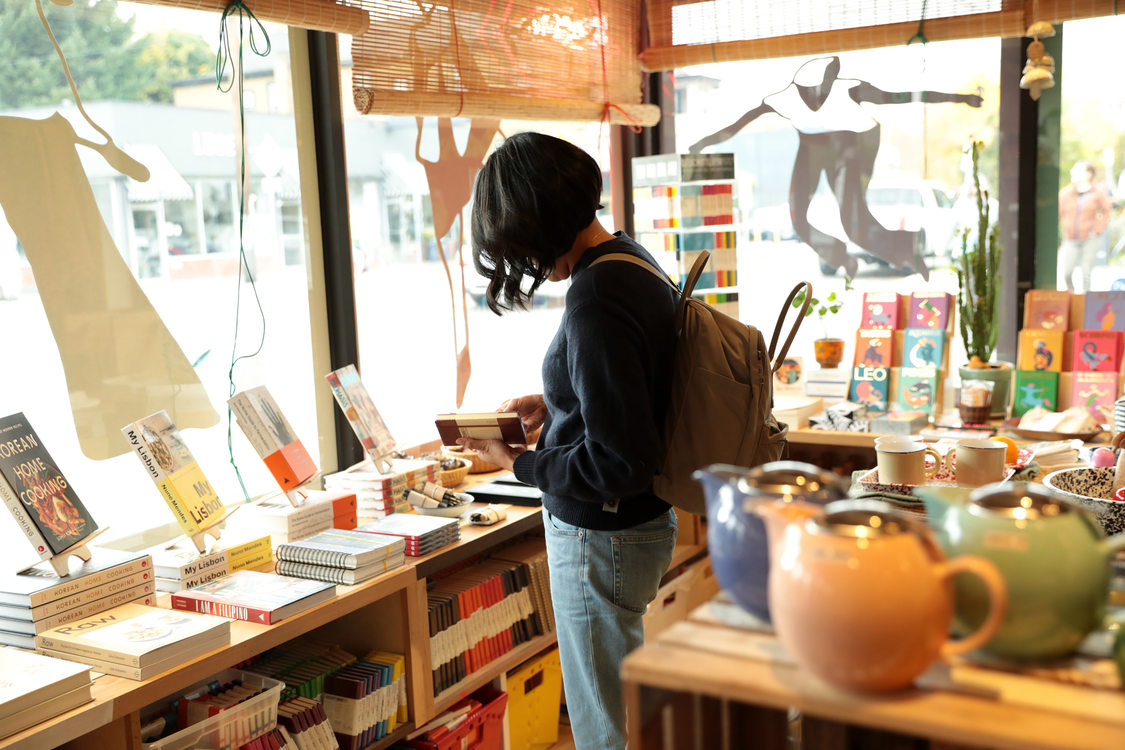 A woman browses through the offerings at a local gift shop