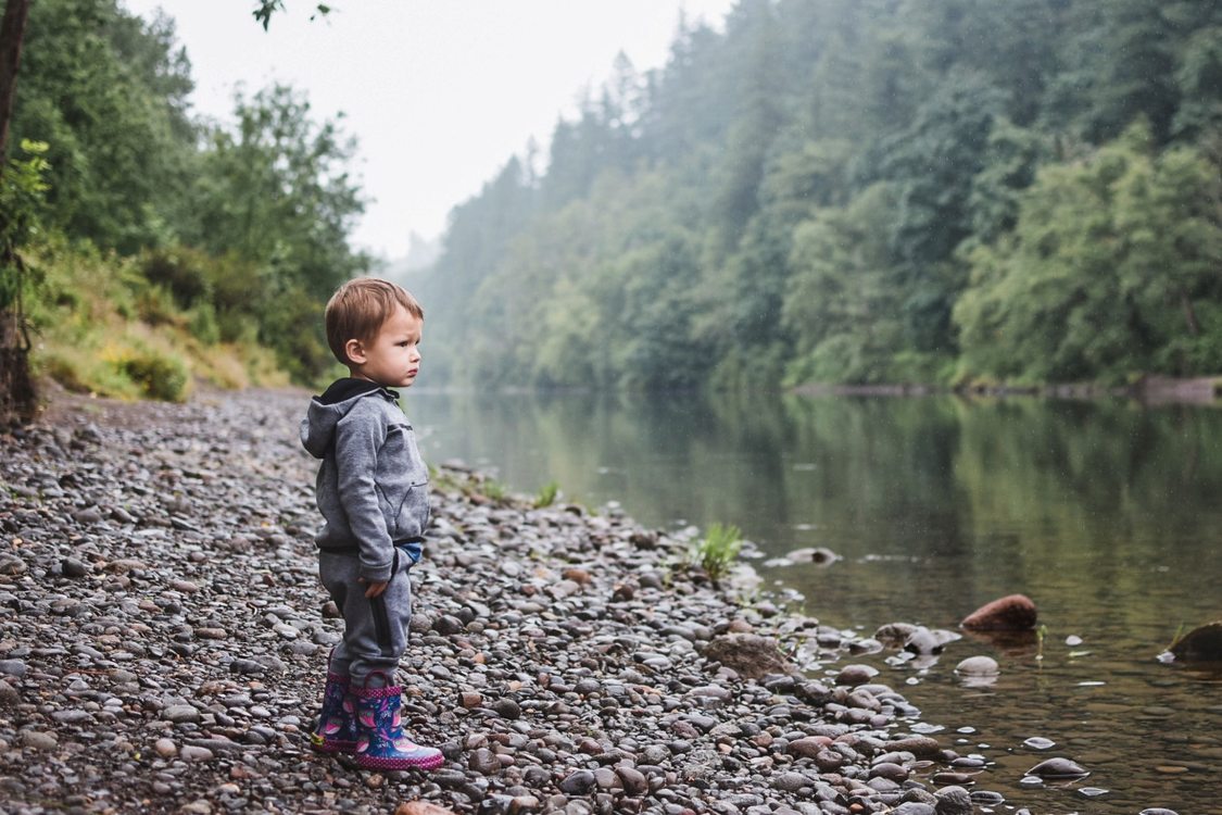 A little child looks out on the Sandy River at Dabney State Park, just outside of Gresham and Troutdale.