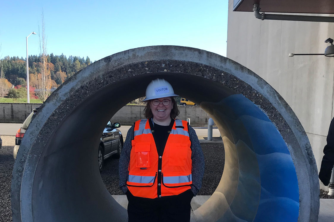 Metro Councilor Christine Lewis stands inside an empty concrete pipe