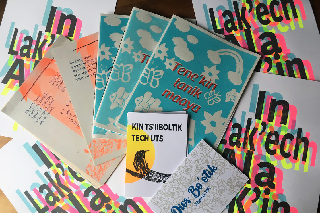 a pile of flyers and informational brochures for the Tene'kin tanik maaya program