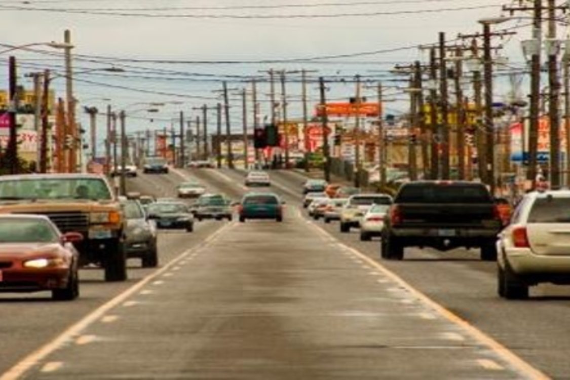 traffic going in both directions on the busy 82nd Avenue