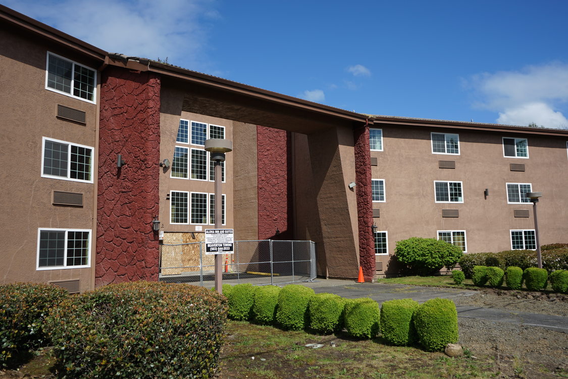 Aloha Inn affordable housing project in Washington County, showing the front entrance to the 3-story building still under construction