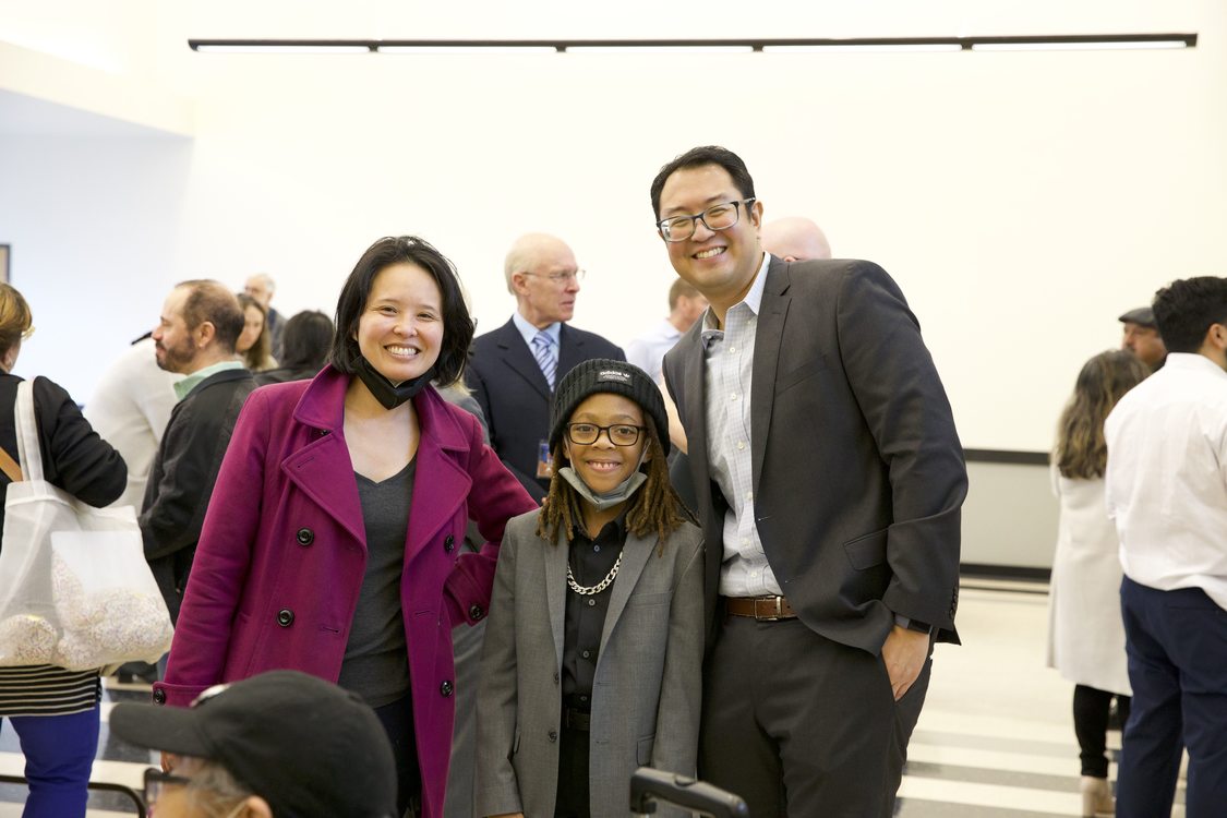 Metro Councilor Duncan Hwang stands next to Representative Khanh Pham and AJ Simpson in East Portland Community Center for the 2023 Metro Council inauguration ceremony.