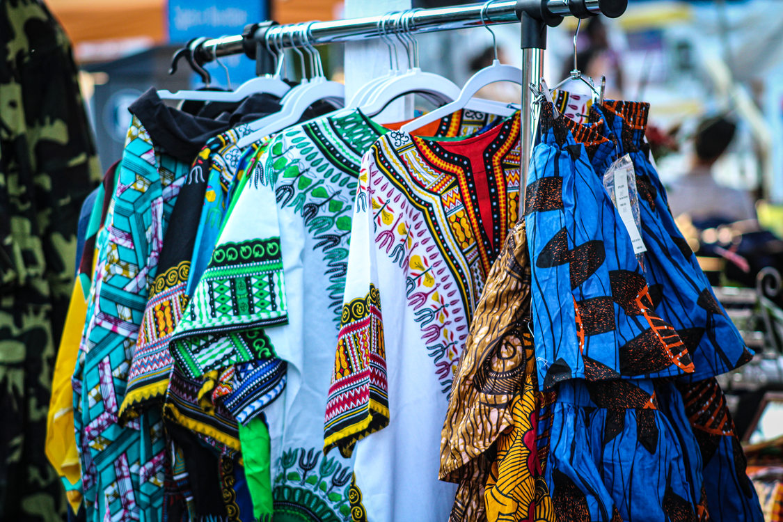 A wrack of colorful clothing with intricate designs and patterns