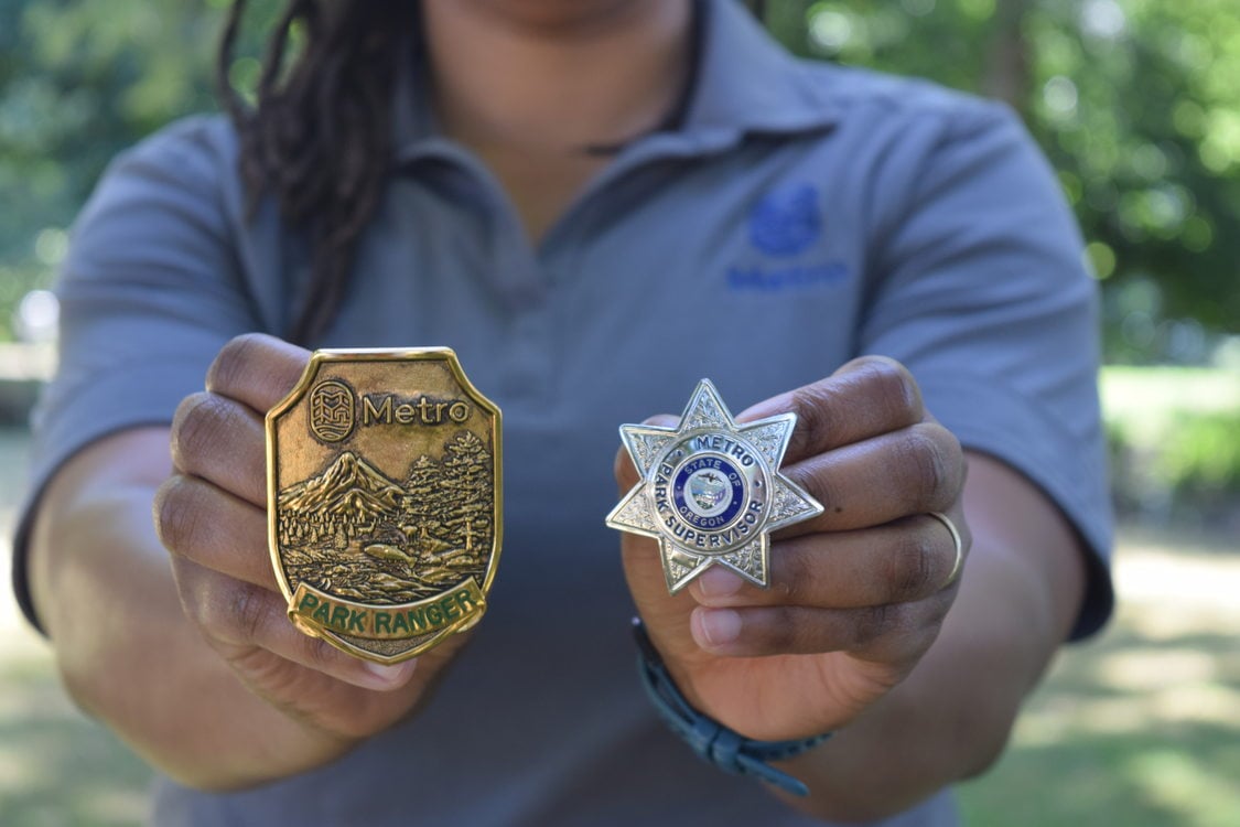 Miles-Kingrey holds the old seven-star badge and Metro’s new ranger badge.