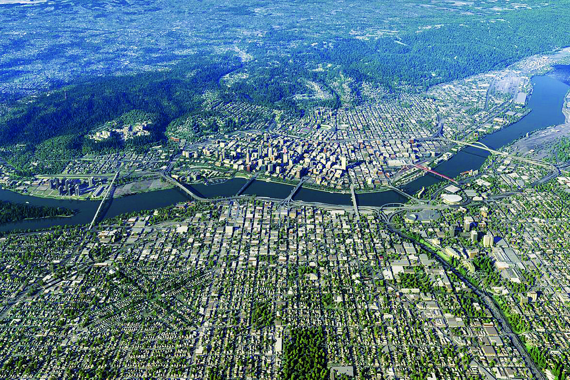 Aerial photo of downtown Portland looking west, with the Willamette River running across from left to right. The street grid and many major bridges across the river are visible.