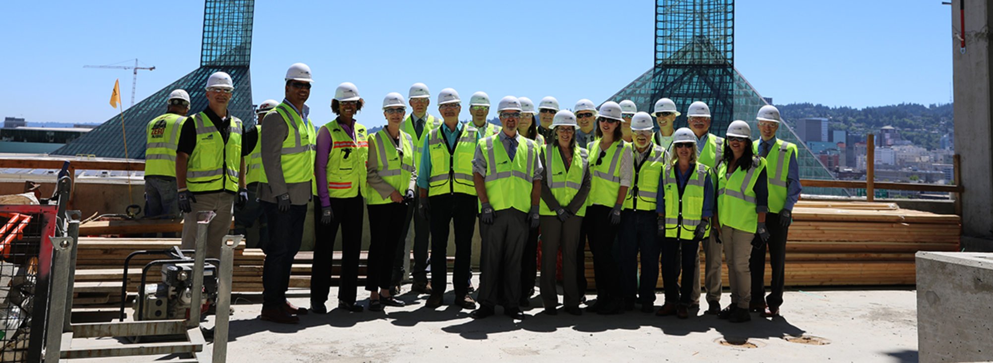 group of people in hard hats being led on a construction tour of the Hyatt Hotel at Oregon Convention Center