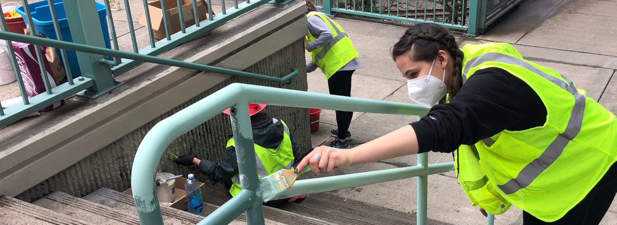 An image of a person cleaning up graffiti