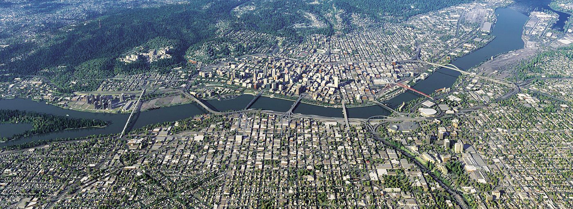 Aerial photo of downtown Portland looking west, with the Willamette River running across from left to right. The street grid and many major bridges across the river are visible.
