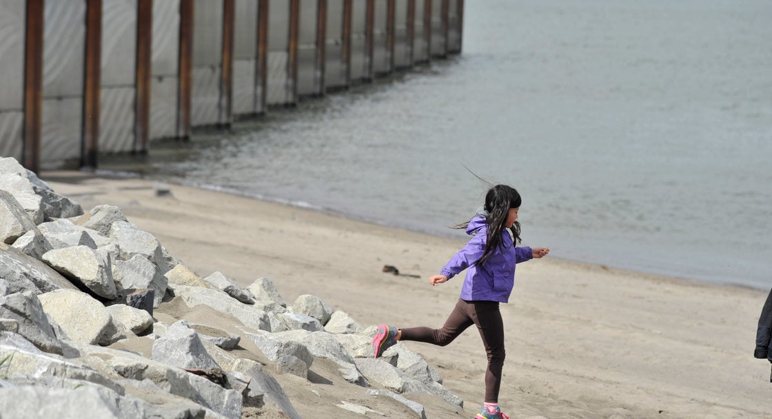 photo of a girl on the sand at Broughton Beach