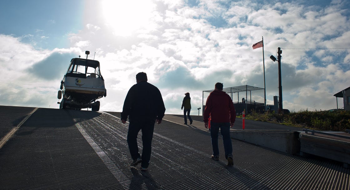 photo of men walking up to a boat at M. James Gleason Boat Ramp